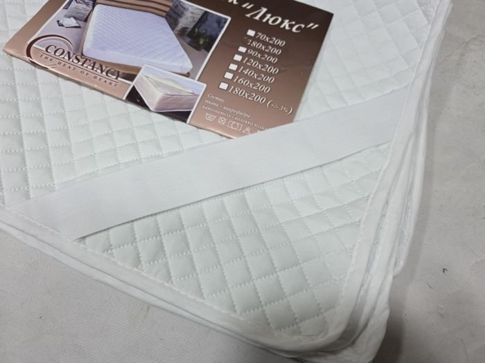 Наматрацник "Constansy-Люкс" 1622/ 160*200 з тканини мікрофібра та з наповненням з волокна холлофайбер +з резинками по кутах -(білий)